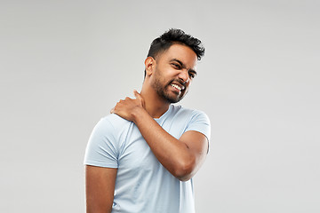 Image showing unhealthy indian man suffering from neck pain