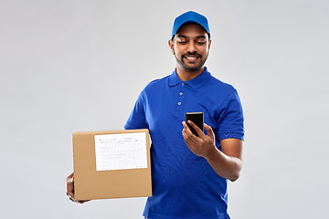 Image showing indian delivery man with smartphone and parcel box