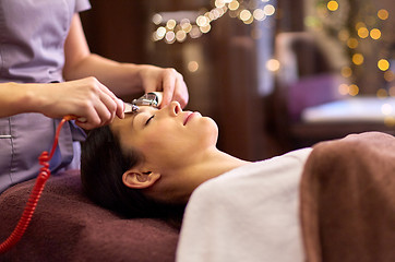 Image showing woman having hydradermie facial treatment in spa