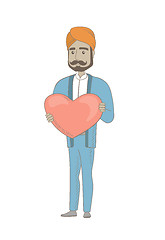 Image showing Hindu businessman holding a big red heart.