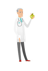 Image showing Caucasian nutritionist offering fresh red apple.