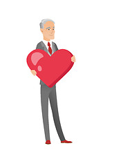 Image showing Caucasian businessman holding a big red heart.