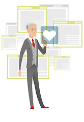 Image showing Senior businessman pressing web button with heart.