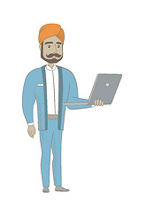 Image showing Hindu businessman using laptop.