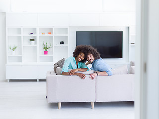 Image showing young multiethnic couple in living room