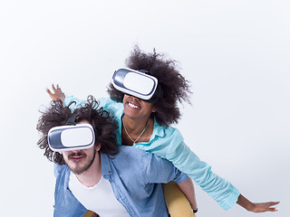 Image showing multiethnic couple getting experience using VR headset glasses