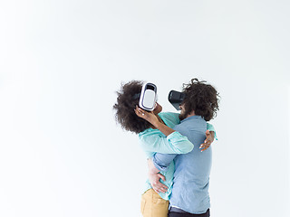 Image showing multiethnic couple getting experience using VR headset glasses