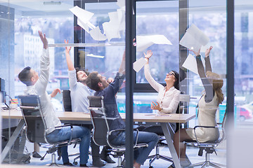 Image showing startup Group of young business people throwing documents