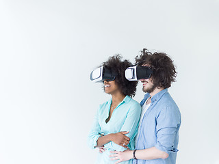 Image showing multiethnic couple getting experience using VR headset glasses