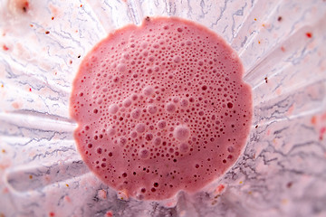 Image showing Freshly made strawberries smoothie with chia seeds in blender cup, top view