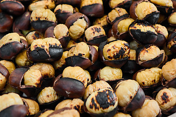 Image showing Grilled chestnuts for sale on street