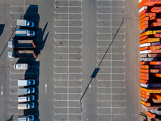 Image showing Ukraine, Kiev. April 08, 2018. Building store Epicentr K. Parking place, warehouse storage of building materials and trucks, ready for loading with building materials.