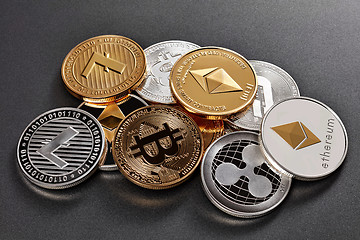 Image showing Different coins of crypto currency on a dark background