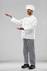 Image showing happy male indian chef in toque