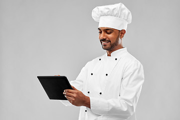 Image showing happy male indian chef with tablet computer