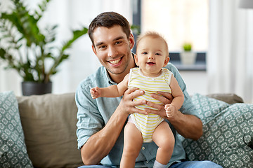 Image showing father with little baby daughter at home