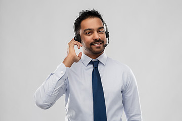 Image showing indian businessman or helpline operator in headset