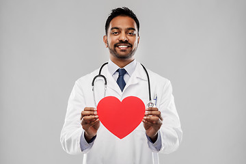 Image showing smiling indian male doctor with red heart shape