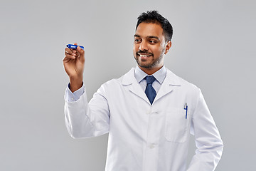 Image showing indian male doctor or scientist with marker