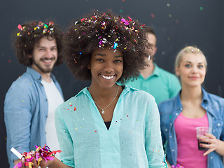 Image showing confetti party multiethnic group of people isolated over gray