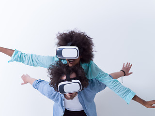 Image showing multiethnic couple getting experience using VR headset glasses