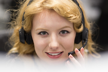 Image showing female call centre operator doing her job