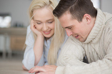 Image showing Young Couple using digital tablet on cold winter day