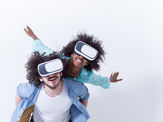 Image showing multiethnic couple getting experience using VR headset glasses