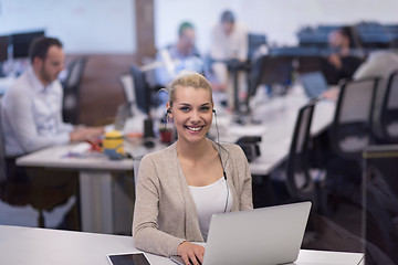 Image showing businesswoman using a laptop in startup office