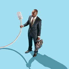 Image showing Man holding USB cable in hand