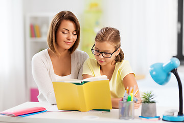 Image showing mother and daughter doing homework together