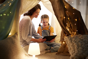 Image showing family with tablet pc in kids tent at home