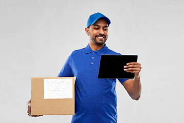 Image showing indian delivery man with tablet pc and parcel box