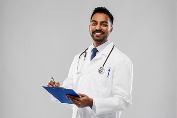 Image showing indian male doctor with clipboard and stethoscope