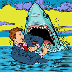 Image showing The shark attacks the businessman. Man afraid