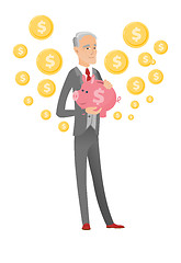 Image showing Senior caucasian businessman holding a piggy bank.