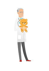 Image showing Senior caucasian pediatrician holding teddy bear.