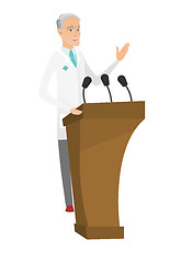 Image showing Caucasian doctor giving a speech from tribune.