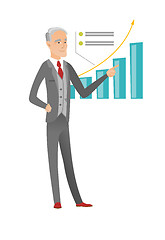 Image showing Senior caucasian businessman pointing at chart.