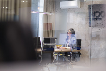 Image showing businesswoman using a laptop in startup office