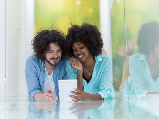Image showing Couple relaxing together at home with tablet computer