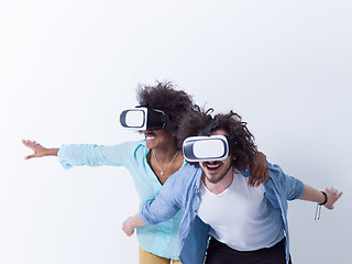 Image showing multiethnic couple getting experience using VR headset glasses