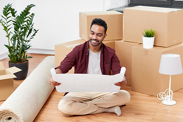 Image showing man with boxes and blueprint moving to new home