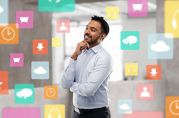 Image showing indian businessman with app icons at office