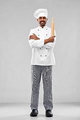 Image showing happy male indian chef or baker with rolling-pin