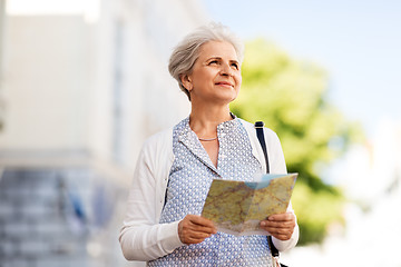 Image showing senior woman or tourist with map on city street