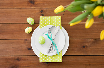 Image showing easter egg in cup holder, plates and cutlery