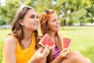 Image showing teenage girls eating watermelon at picnic in park