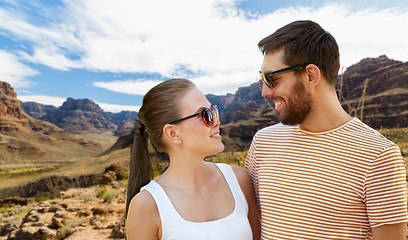 Image showing couple in sunglasses in summer over grand canyon