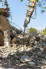 Image showing Jackhammer on an excavator manipulator, on the ruins of a building